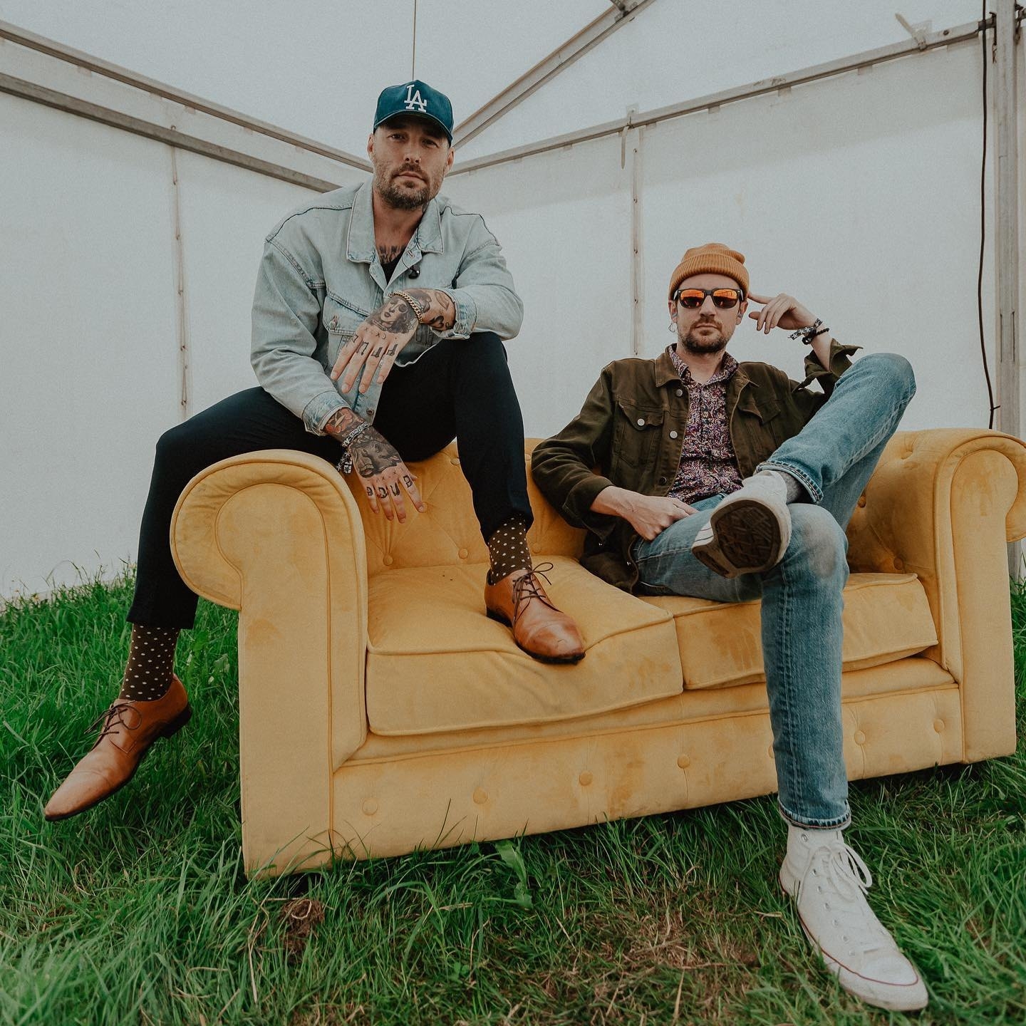 emarosa band memebers sitting on a couch